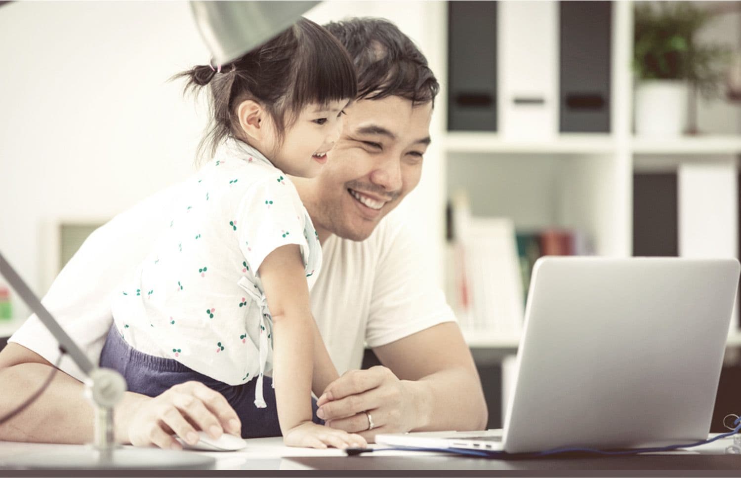 A father working from home with ease thanks to his back up portable aircon