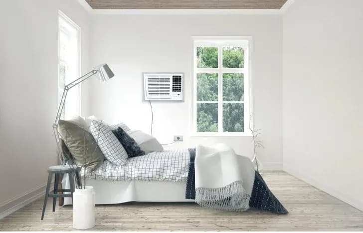 A Carrier window type aircon cooling a relatively small bedroom