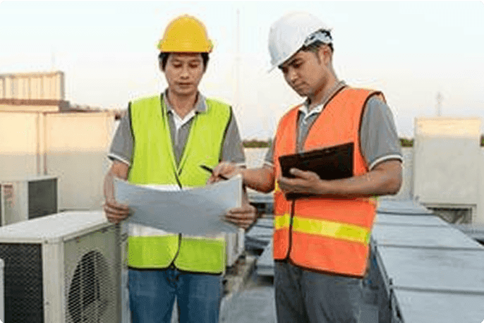 Retrofit service experts in the process of checking whether an HVAC system is operating smoothly.