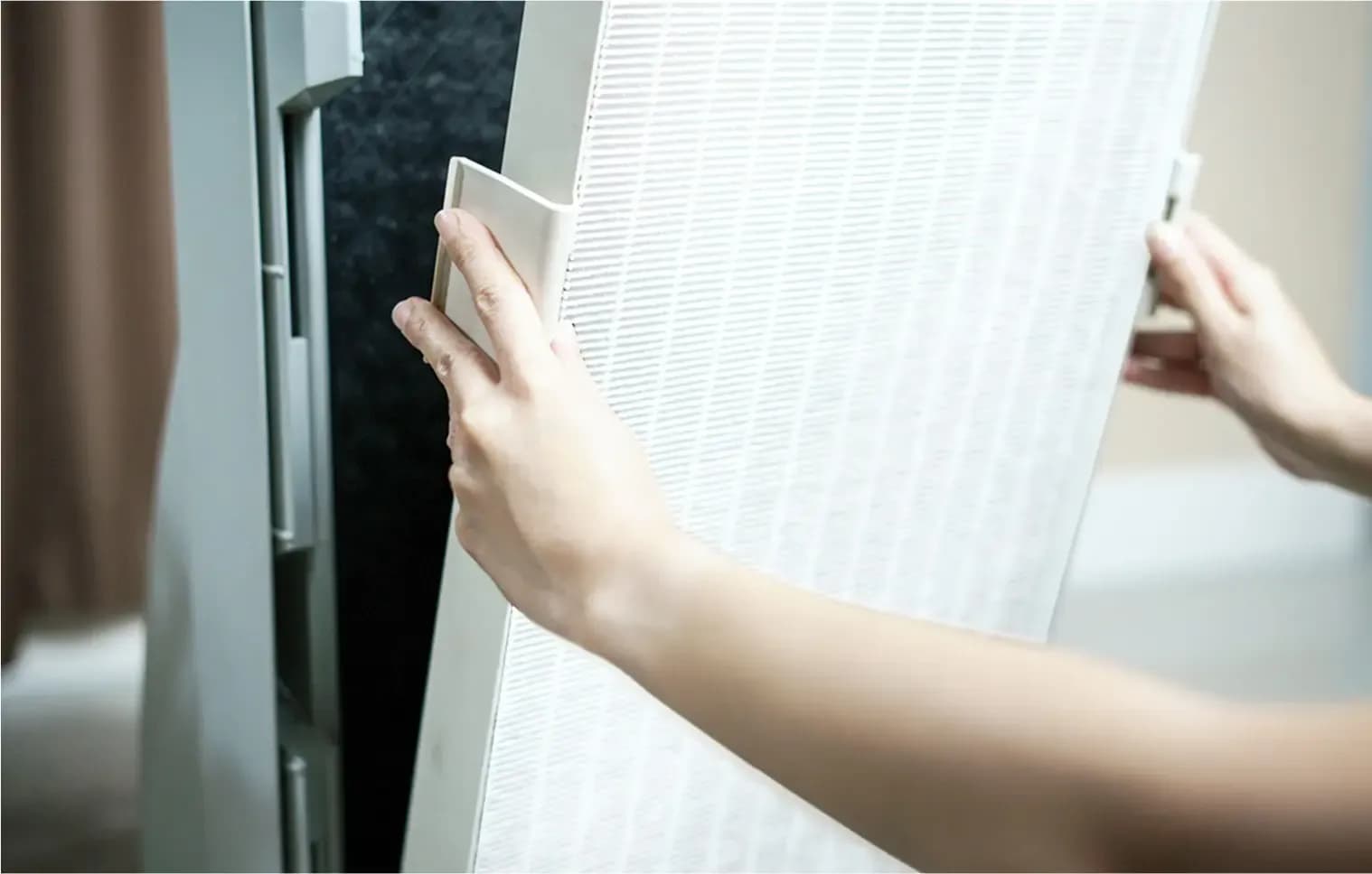 homeowner setting up their air purifier