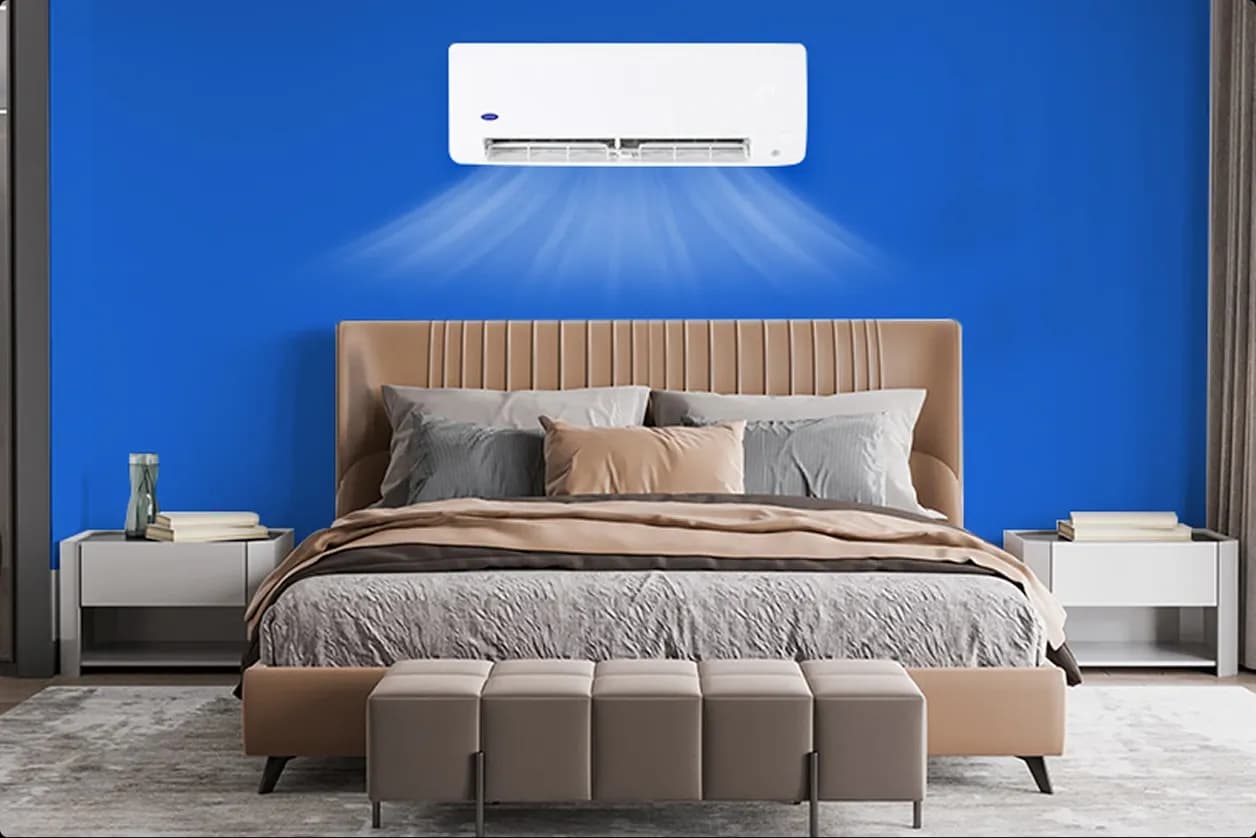 A Carrier Aura Philippines wall mounted aircon cooling a bedroom with clean and comforting air. 