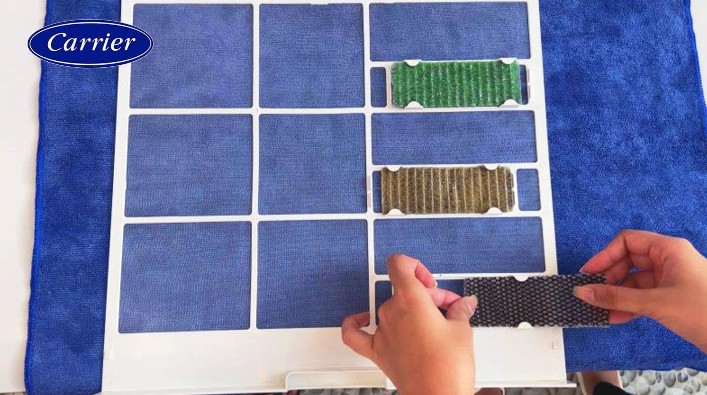 Placing the special filters back in the slots of the dry main air filter