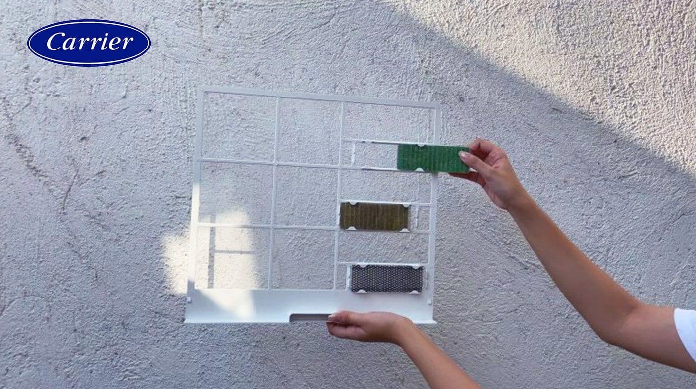 Removing the special air filters and shaking off the dust in an outdoor space